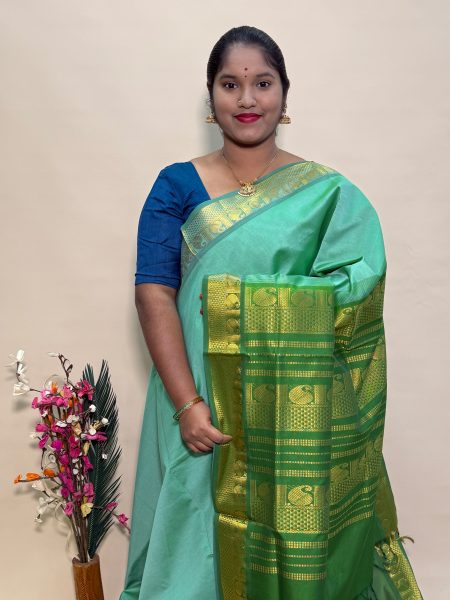 Semi Silk Cotton Plain In Pastel Green And Olive Green With Traditional Border