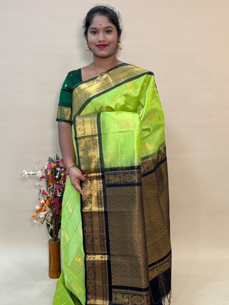 Mayil Chakram Silk Cotton in Apple Green And Black With Traditional Border