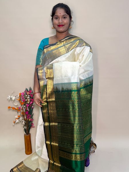 Traditional Silk Cotton Lakshadeepam Saree In Half White And Green With Traditional Border