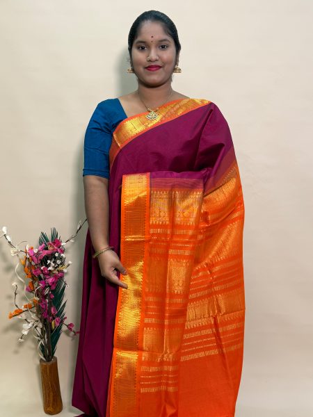 Semi Silk Cotton Plain In Maroon And Orange With Traditional Border