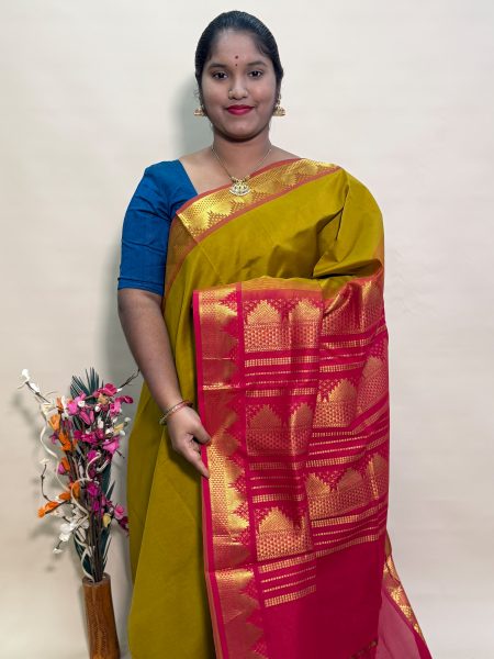 Semi Silk Cotton Plain In Sampanga And Red With Traditional Border