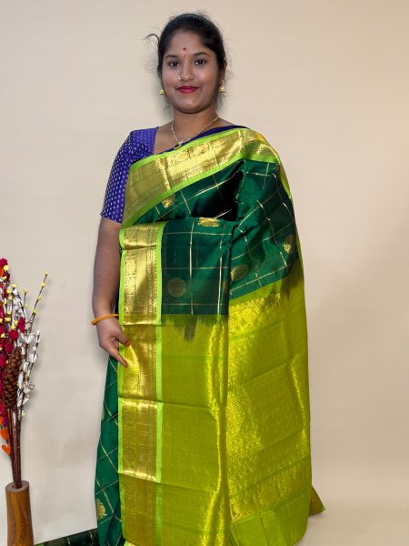 Mayil Chakram Silk Cotton in Green and Olive Green With Traditional Border