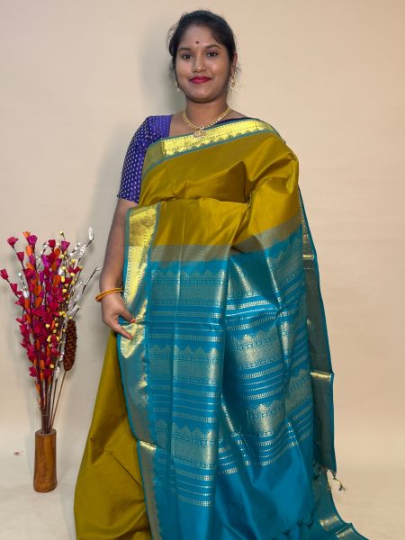 Semi Silk Cotton Plain In Sampanga And Peacock Green With Traditional Border