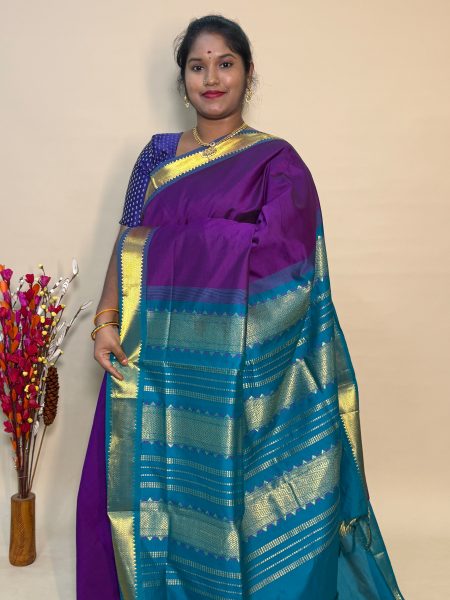 Semi Silk Cotton Plain In Magentha And Peacock Green With Traditional Border