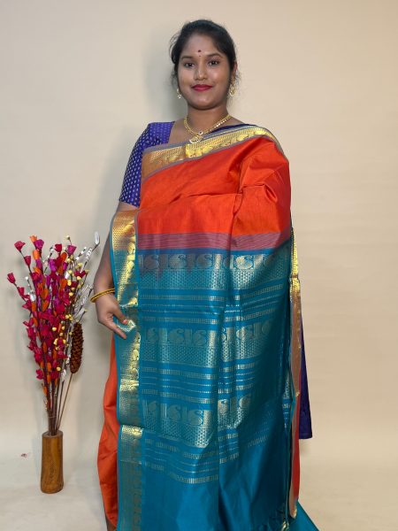 Semi Silk Cotton Plain In Rust Orange And Peacock Green With Traditional Border