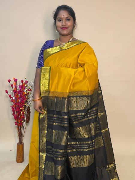 Semi Silk Cotton Plain In Mustard And Black With Traditional Border