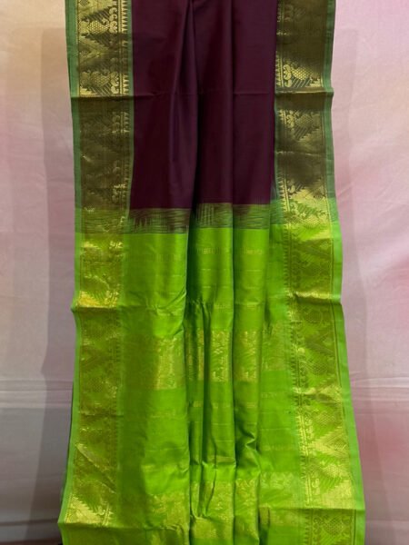 Madisar Semi Silk Cotton In Kunguma Maroon And Olive Green With Traditional Border